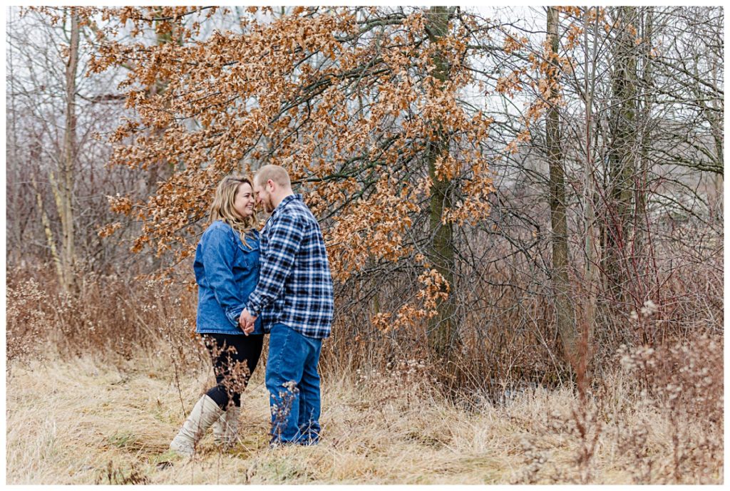 Couple posing in the woods