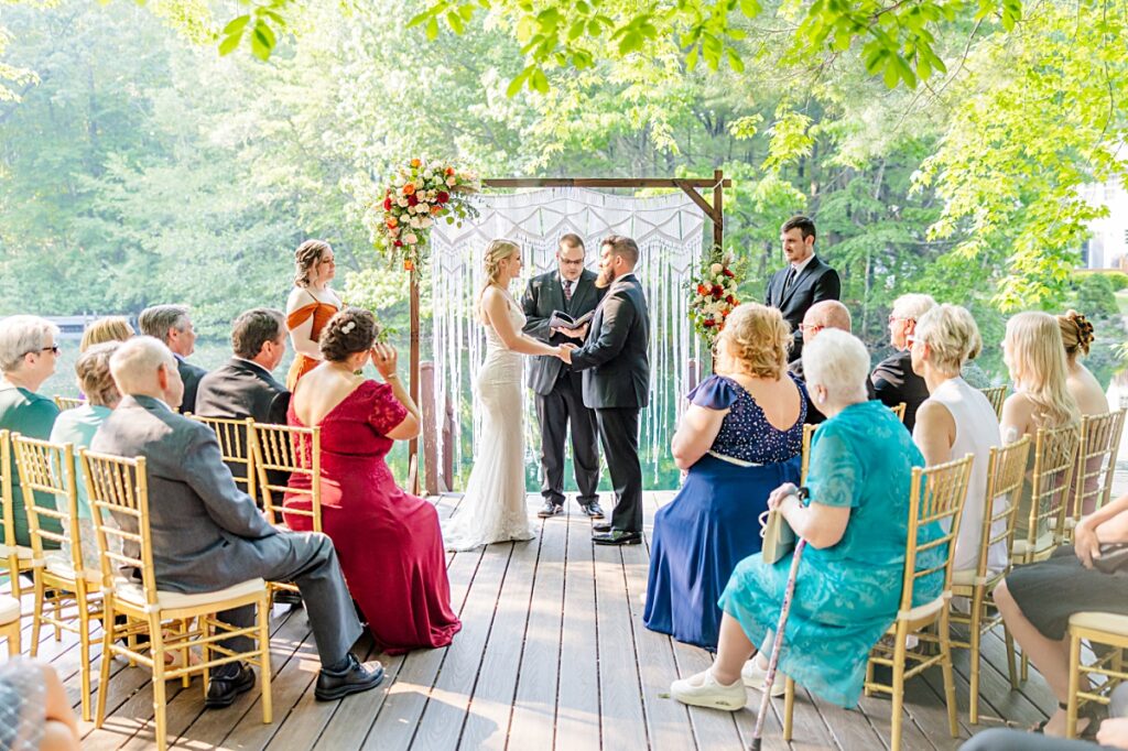 Photograph of small wedding ceremony with one photographer. 