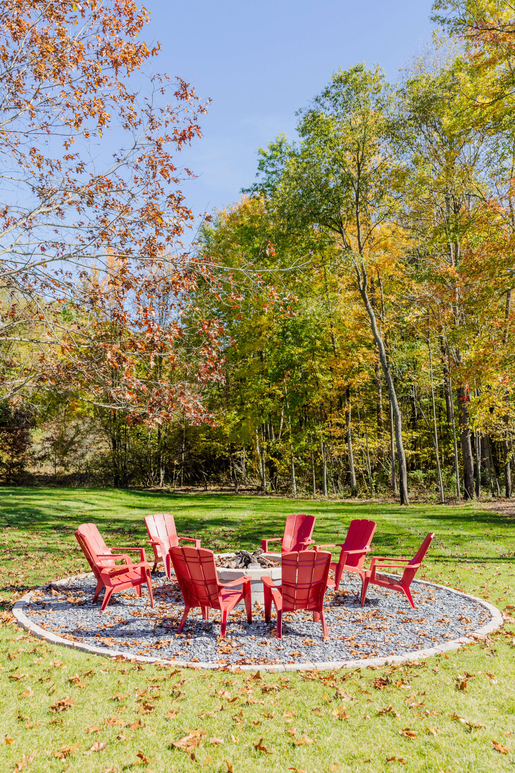 A look at a fire pit with Adirondack chairs